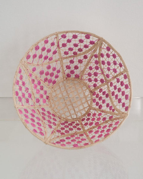 CONTEMPORARY ROUND HANDWOVEN RATTAN BOWL WITH PINK KNOTS