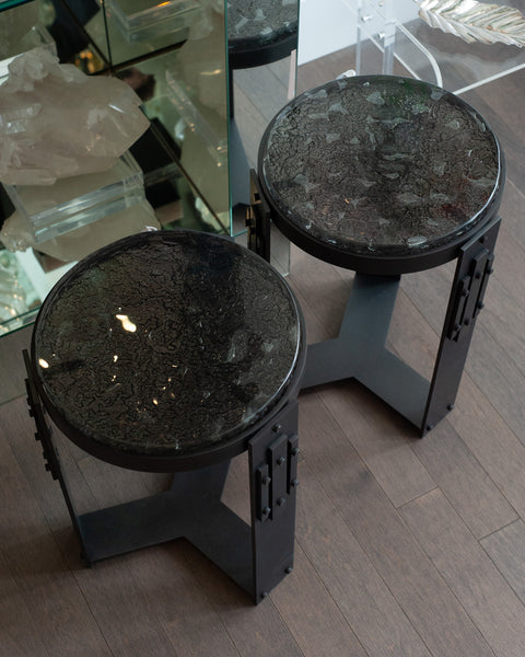 STUDIO MAISON NURITA PAIR OF SMOKED GLASS TABLES WITH BLACKENED BRASS BASES