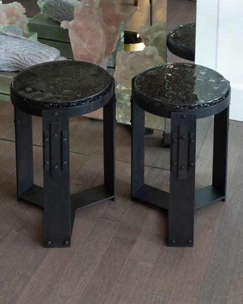 STUDIO MAISON NURITA PAIR OF SMOKED GLASS TABLES WITH BLACKENED BRASS BASES