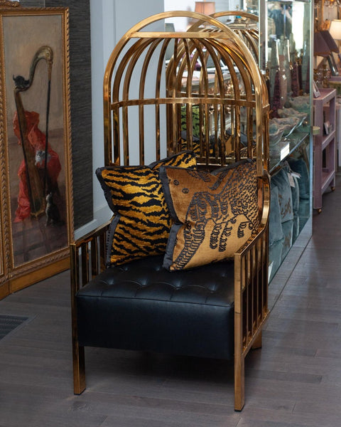CONTEMPORARY POLISHED BRASS AND LEATHER UPHOLSTERED BIRDCAGE CHAIR